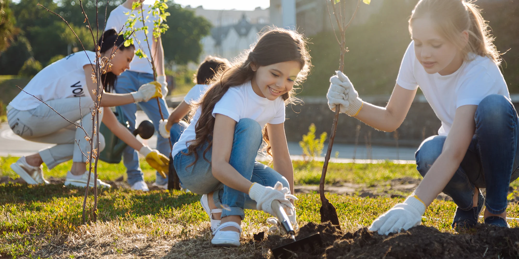 girls planting trees