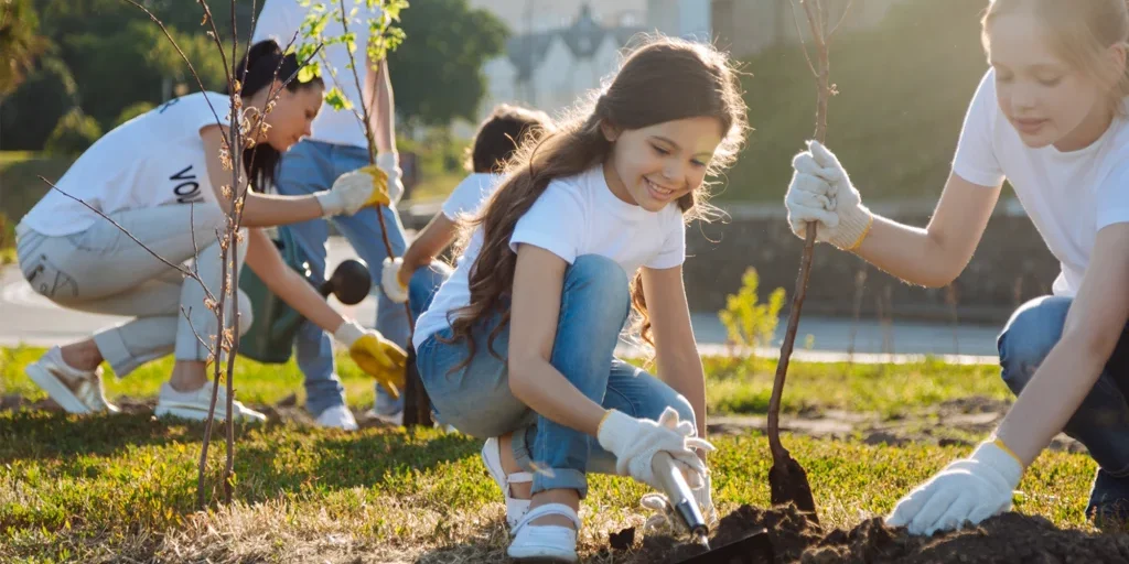 girls planting trees square